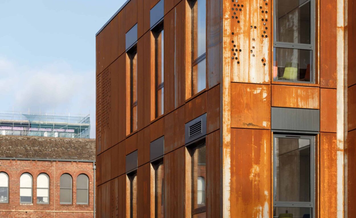 Outside close up view of one side of Leeds City College's new modular building, coated in powdered aluminium.